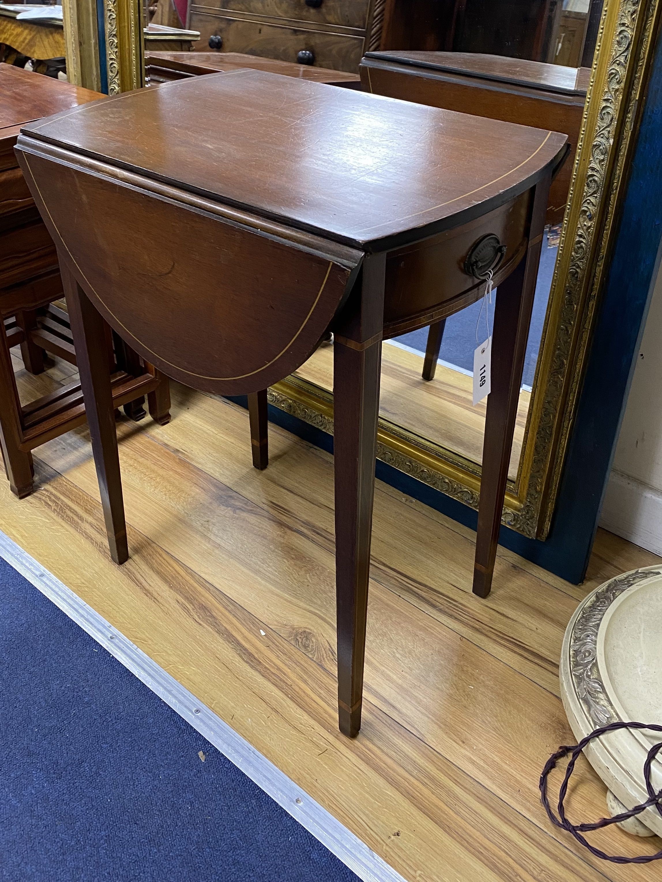 A small inlaid mahogany oval Pembroke table, width 52cm, depth 37cm, height 64cm